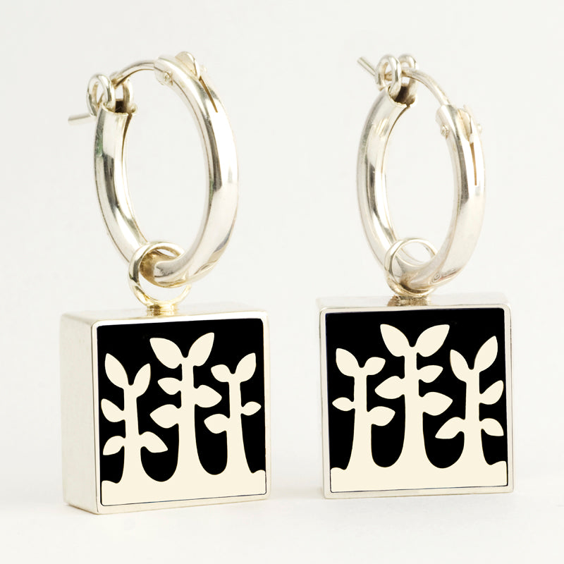 Sterling Hoop With Reversible Charm.