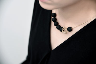 Gold Hexagon Amid Black Balls Necklace